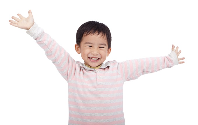 happy asian boy raising hand