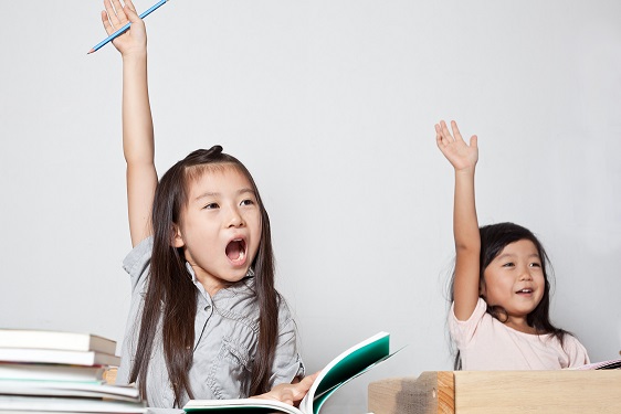 Two little Asian girl getting the answer while studying